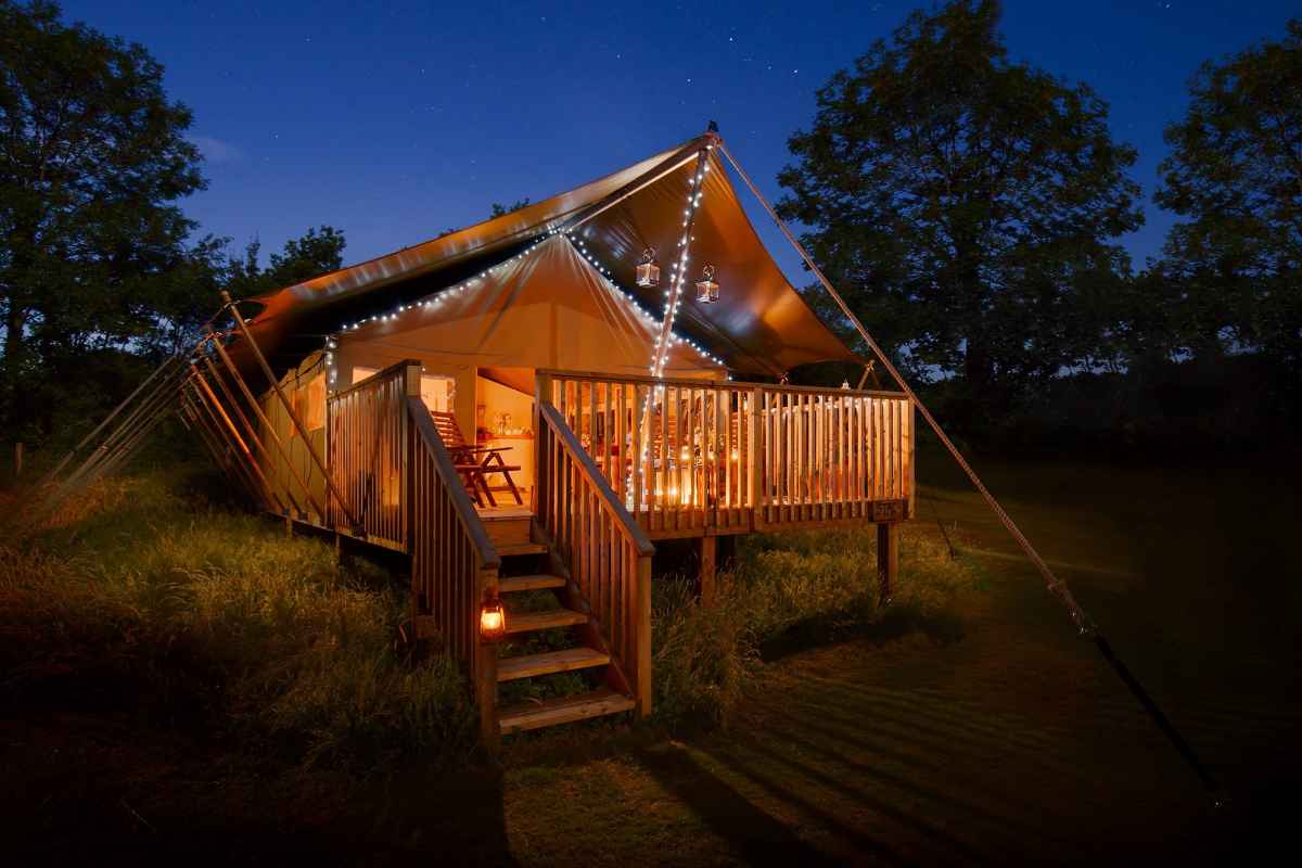 lower-keats-farm-safari-tent-lit-up-at-night-glamping-dorset
