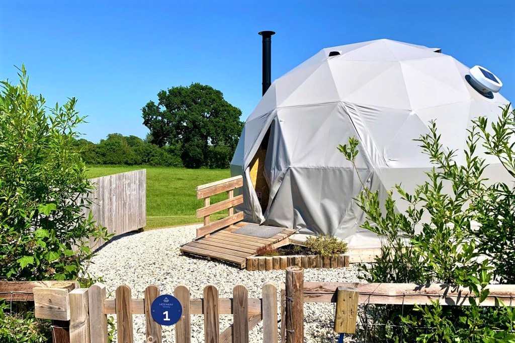 the-dorset-hideaway-geodome-in-field-on-sunny-day-glamping-dorset
