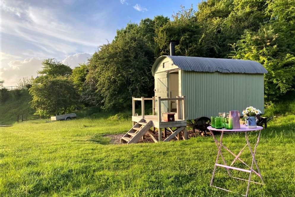 the-hut-at-lime-cottage-in-field-at-sunset-glamping-wiltshire
