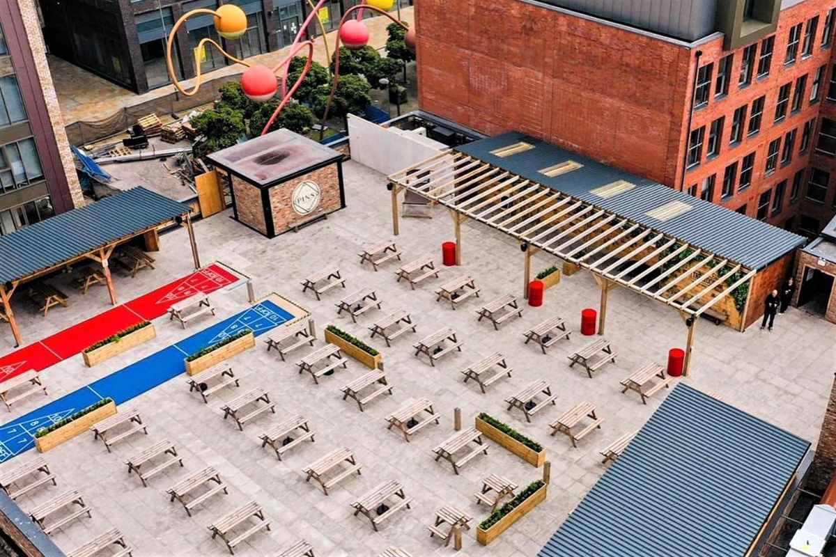 picnic-tables-in-outside-space-at-pins-social-club