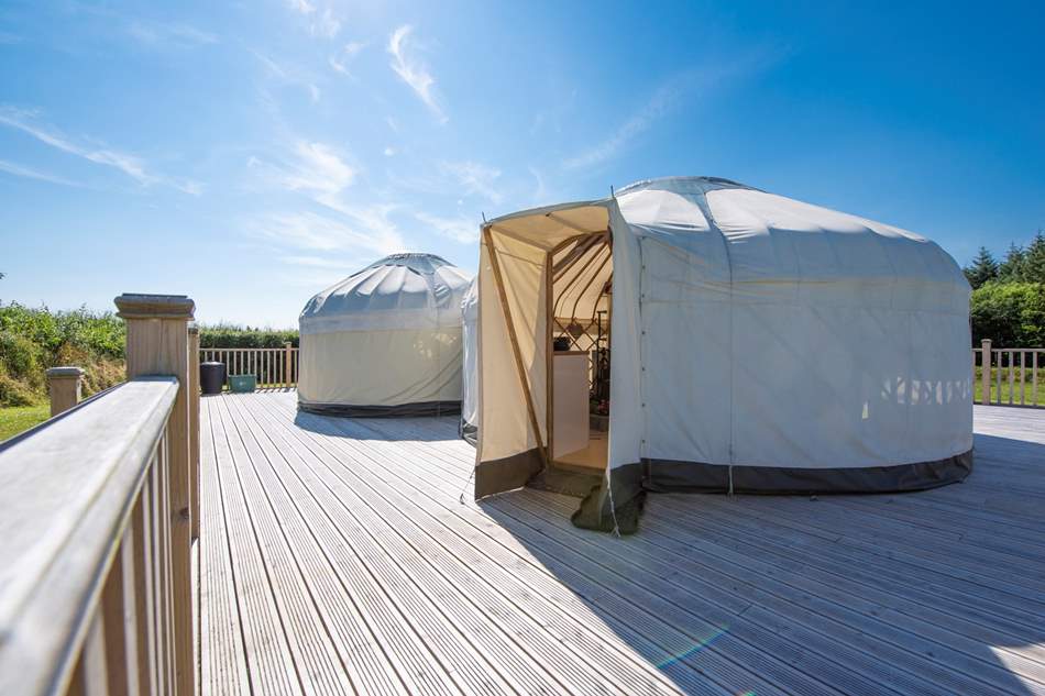 rosewood-yurt-on-decking-on-sunny-day-glamping-devon-hot-tub