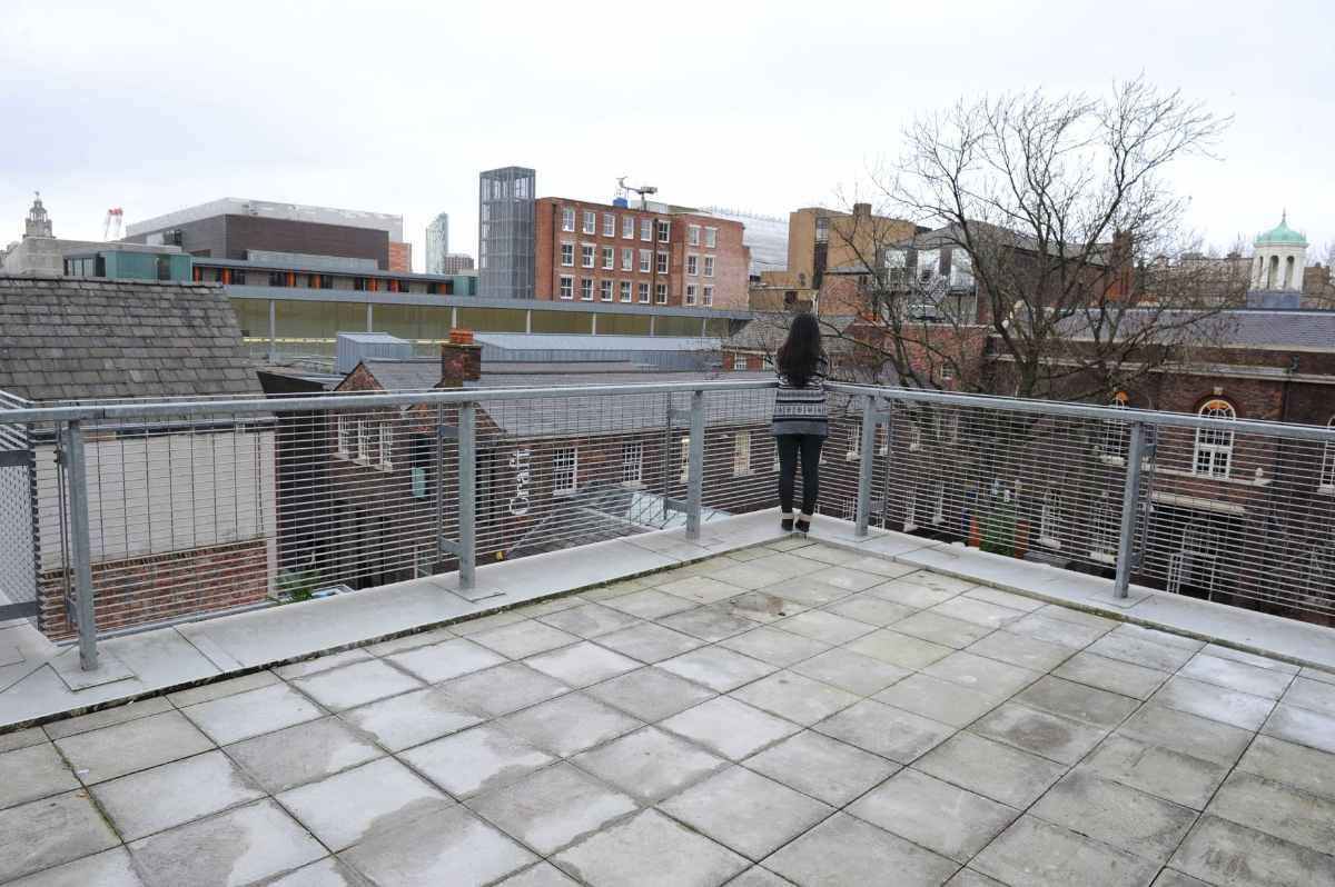 woman-overlooking-city-on-roxy-ball-room-terrace