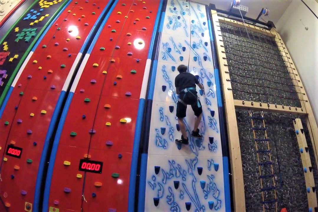 man-climbing-up-indoor-climbing-wall-at-rock-up