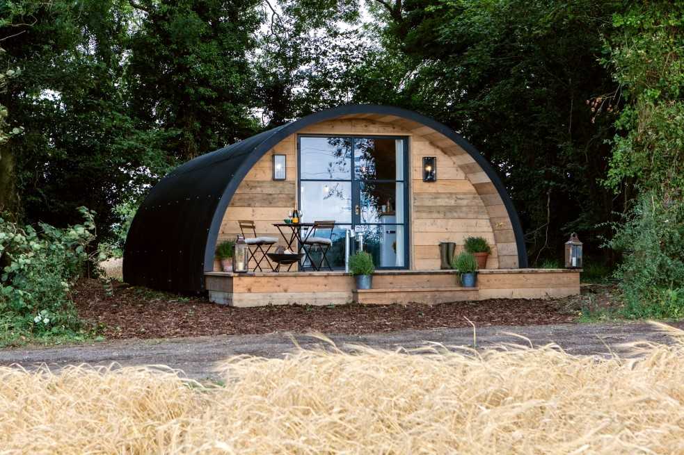 the-pigsty-glamping-pod-surrounded-by-trees-in-daytime