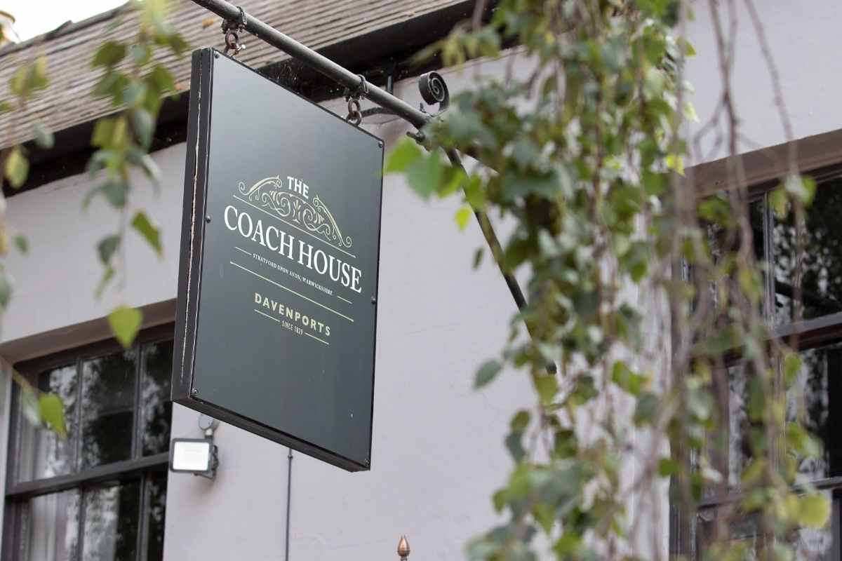 sign-hanging-outside-the-coach-house-pub