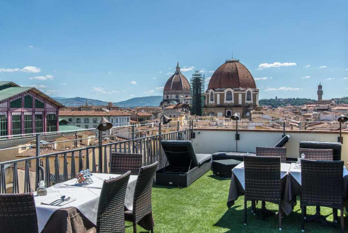 tables-on-roof-machiavelli-palace-in-daytime