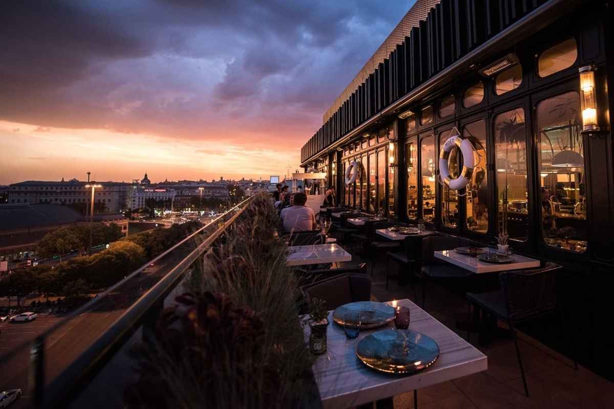 tables-on-terrace-of-only-you-hotel-at-sunset