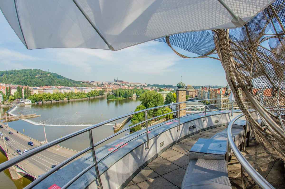 glass-bar-overlooking-river-on-sunny-day