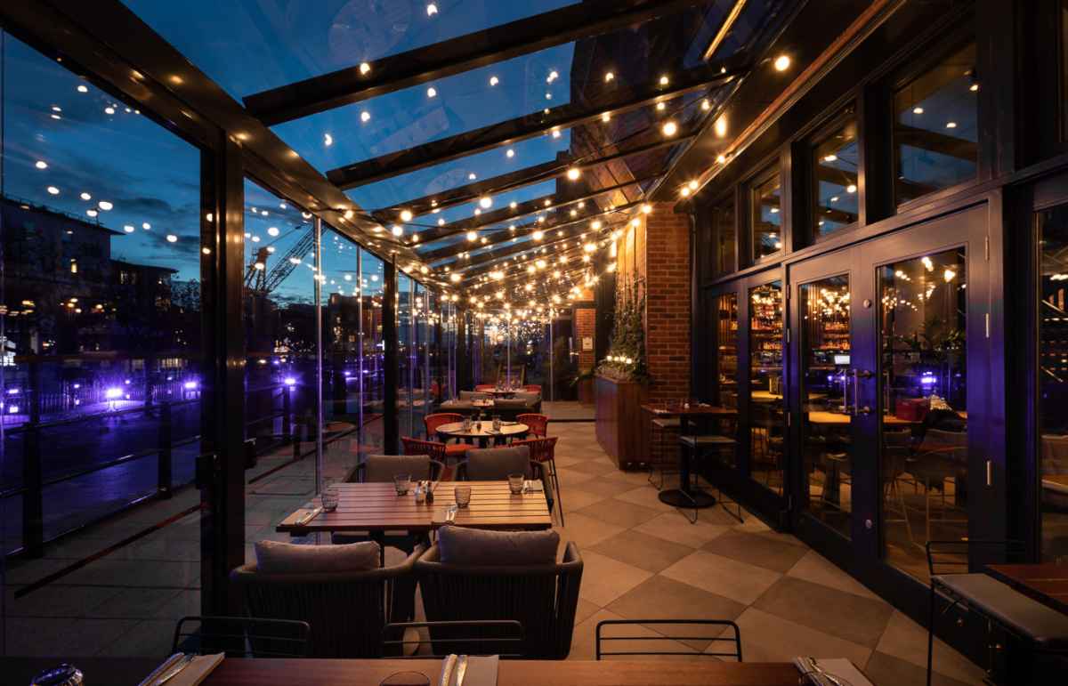 outdoor-dining-at-the-alchemist-lit-up-at-night