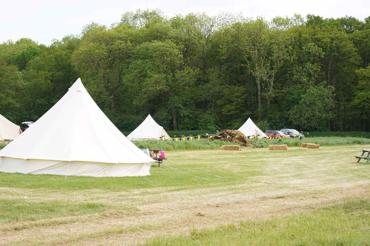 bell-tents-in-field-at-church-farm-ardeley