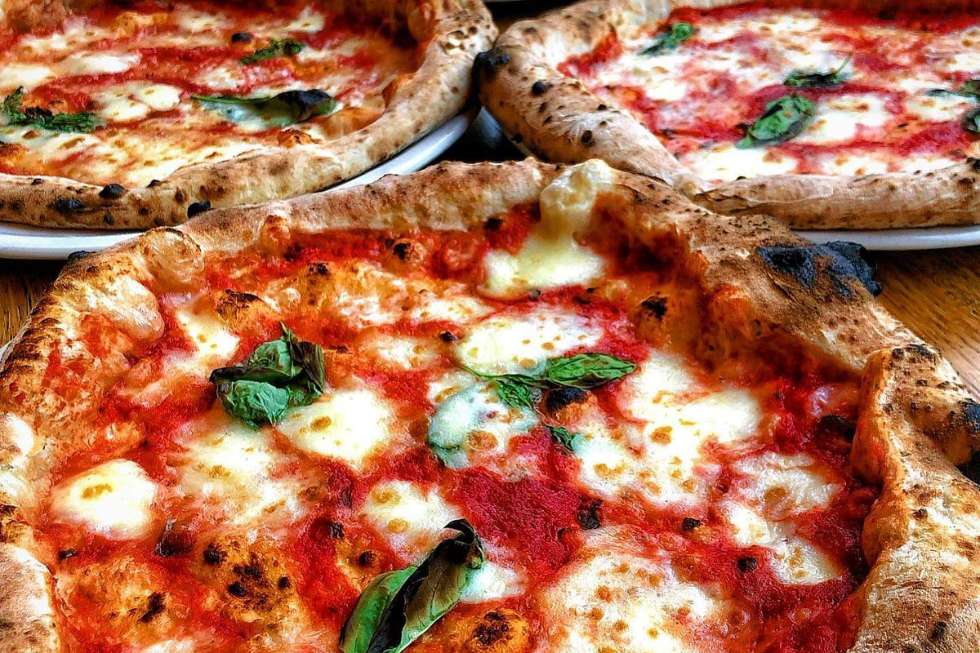 margherita-pizzas-on-wooden-table-crust-bros