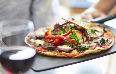 pizza-express-pizza-on-slate-with-wine-in-front