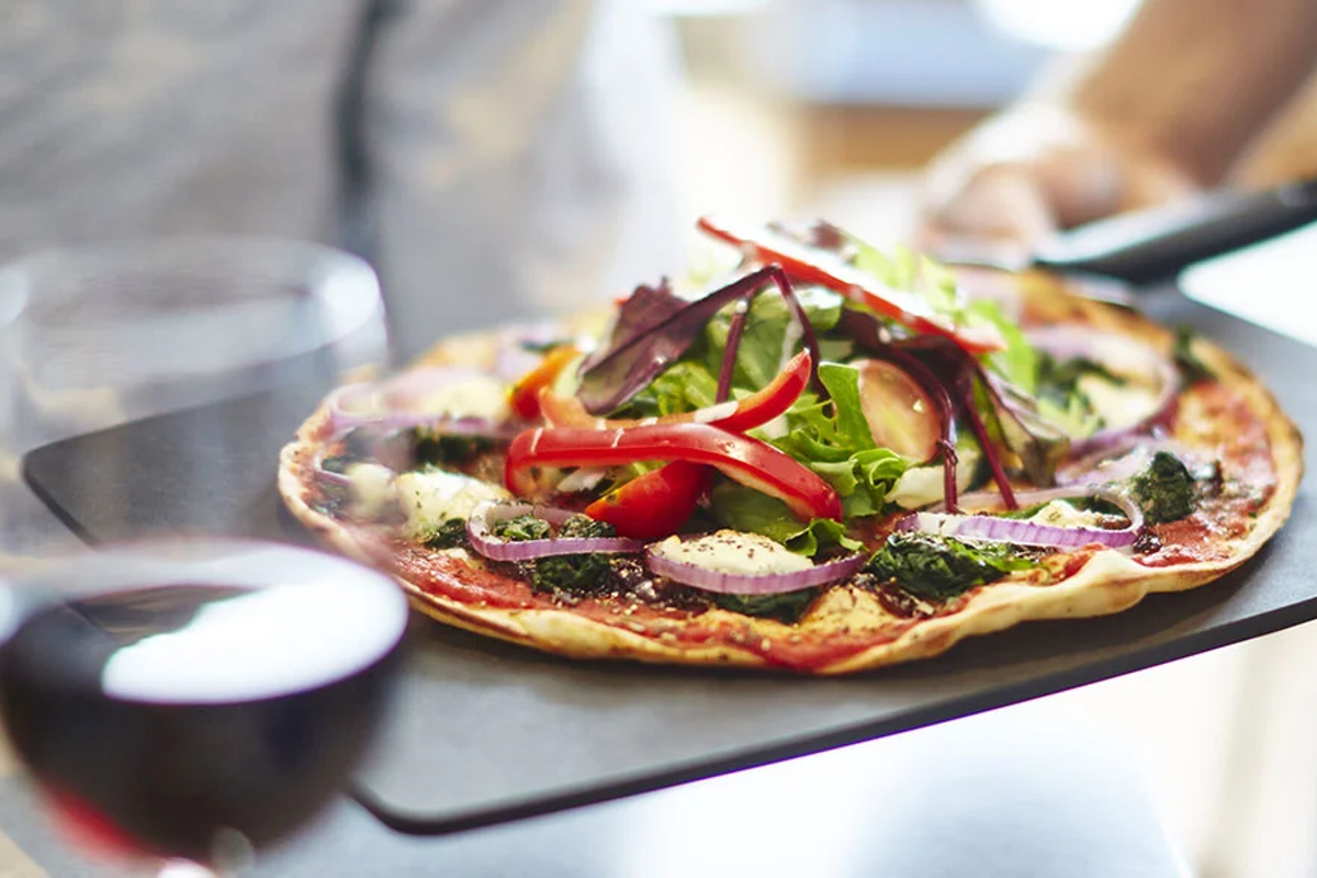 pizza-express-pizza-on-slate-with-wine-in-front