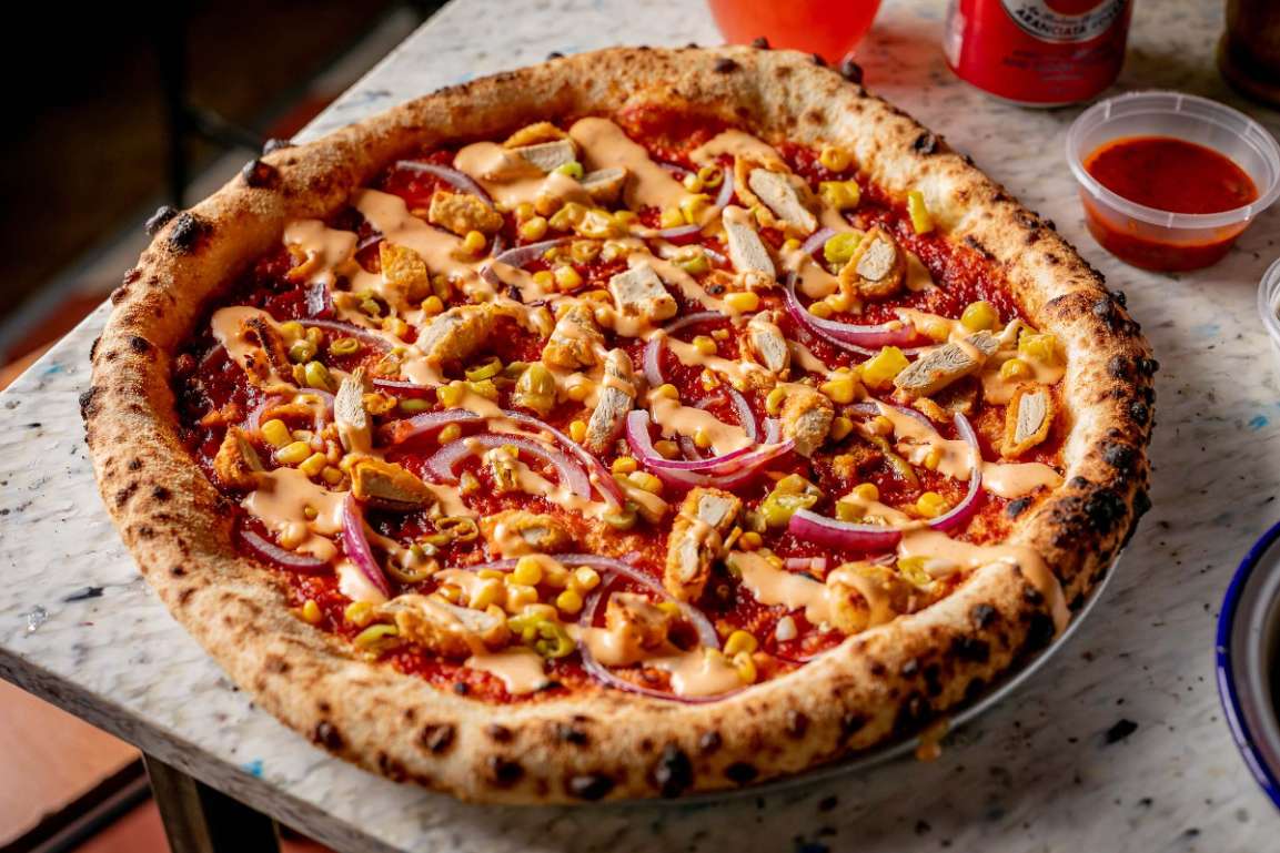 vegan-pizza-on-table-yard-sale-pizza-vegan-pizza-london