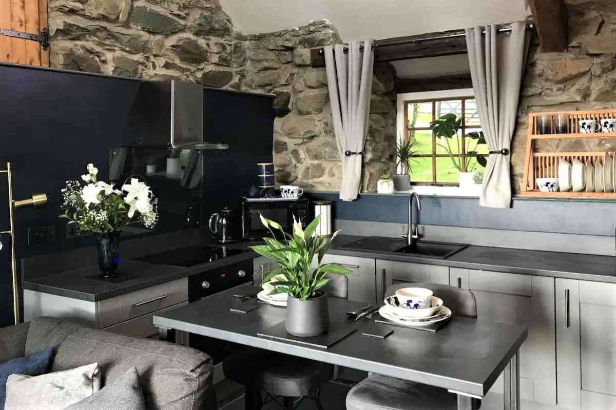 black-and-grey-kitchen-inside-beautiful-cottage