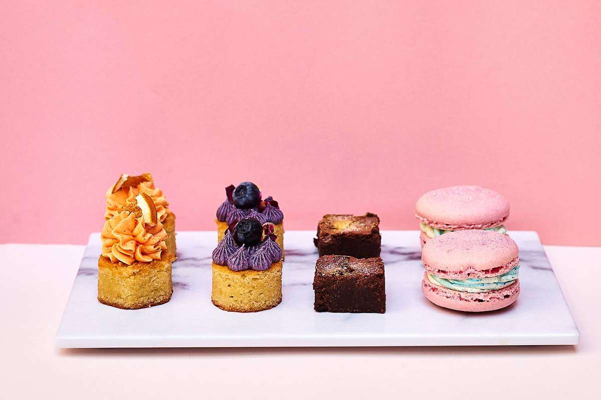 cakes-against-pink-wall-from-pearl-and-groove