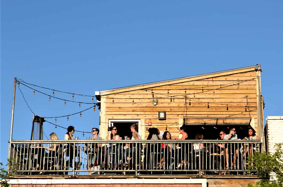people-on-rooftop-of-historians-ale-house-in-daytime