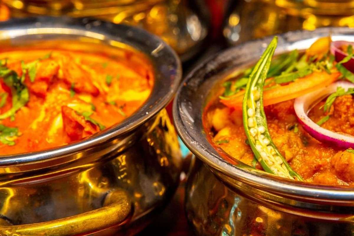 close-up-shot-of-curries-in-metal-dishes-from-mantra