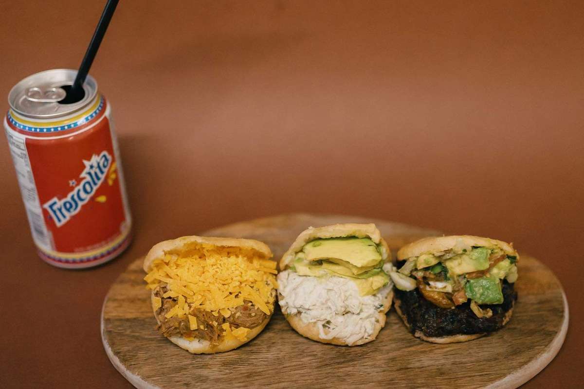 selection-of-mini-arepas-and-a-can-of-drink-noso