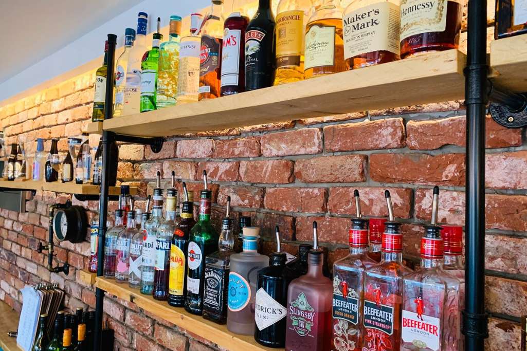 shelf-of-bottles-from-district-bar-cocktail-bars-harrogate