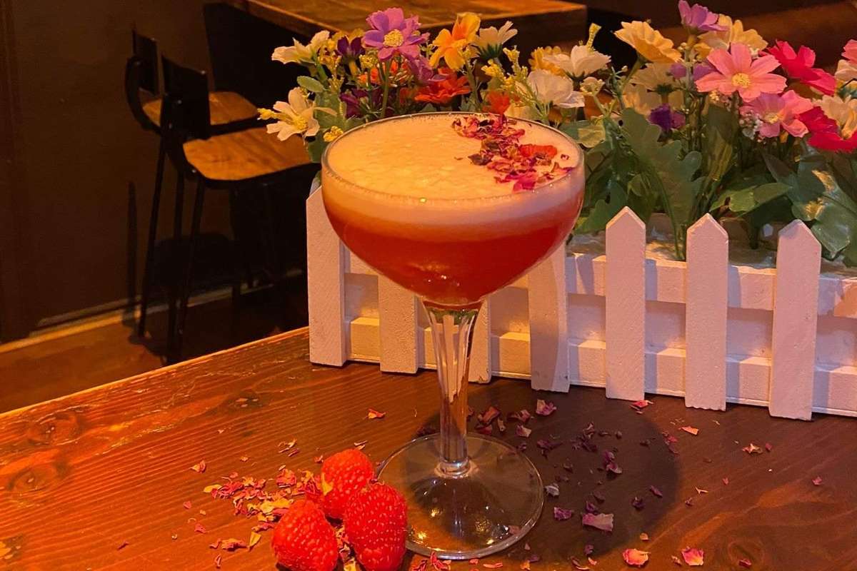 floral-cocktail-against-at-angels-cocktail-bar