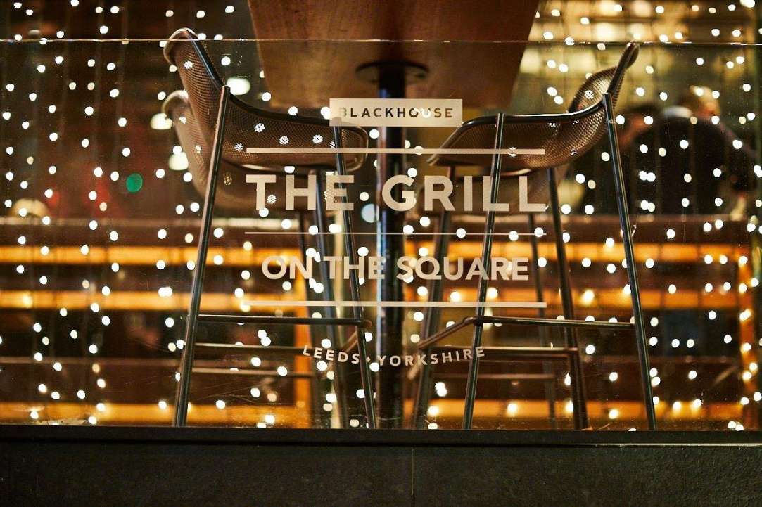 blackhouse-the-grill-on-the-square-lit-up-at-night