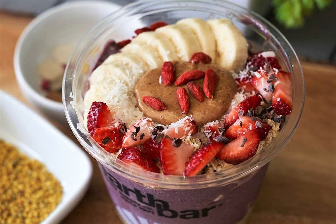 earthbar-acai-bowl-topped-with-peanut-butter-and-fruit