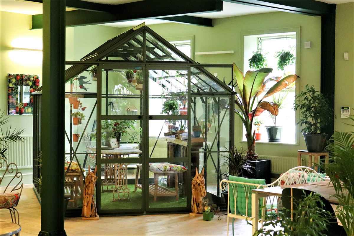 greenhouse-and-plants-inside-use-space-in-daytime