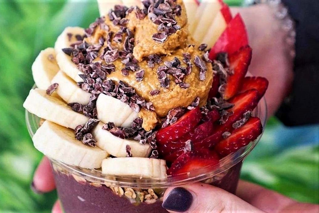 hand-holding-bowl-topped-with-peanut-butter-from-lovabowl