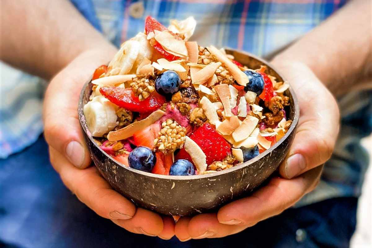 man-holding-acai-bowl-from-seedling-cafe