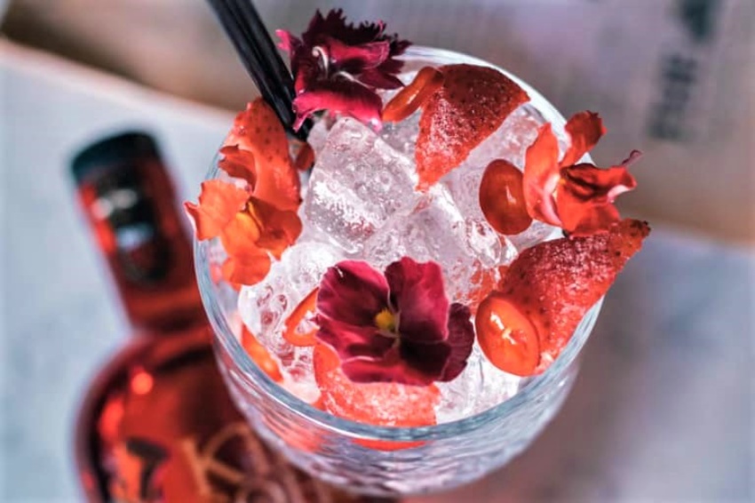 cocktail-topped-with-flowers-at-gin-64-in-penarth