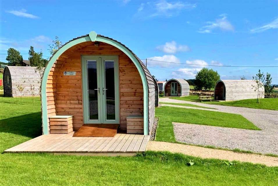 exterior-of-glamping-pod-at-hill-top-huts-on-sunny-day