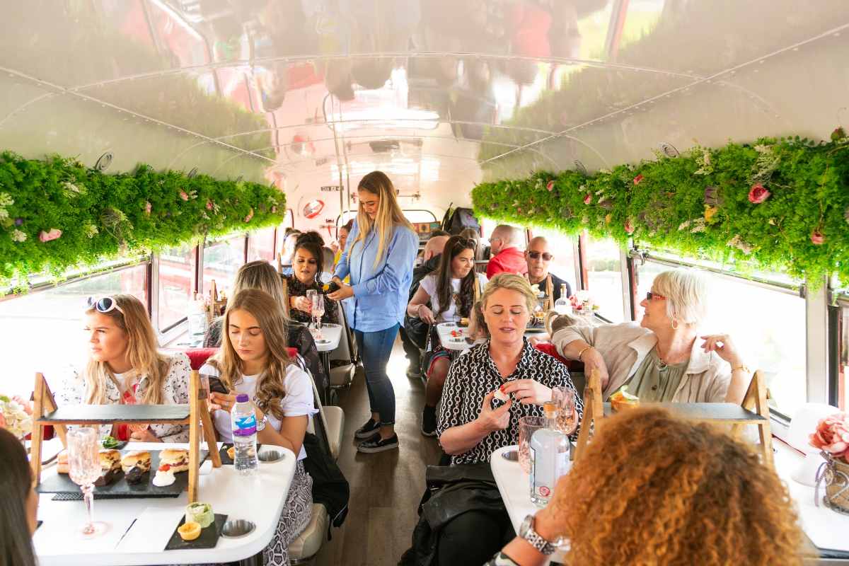 groups-of-people-sat-on-red-bus-bistro-bus-in-daytime