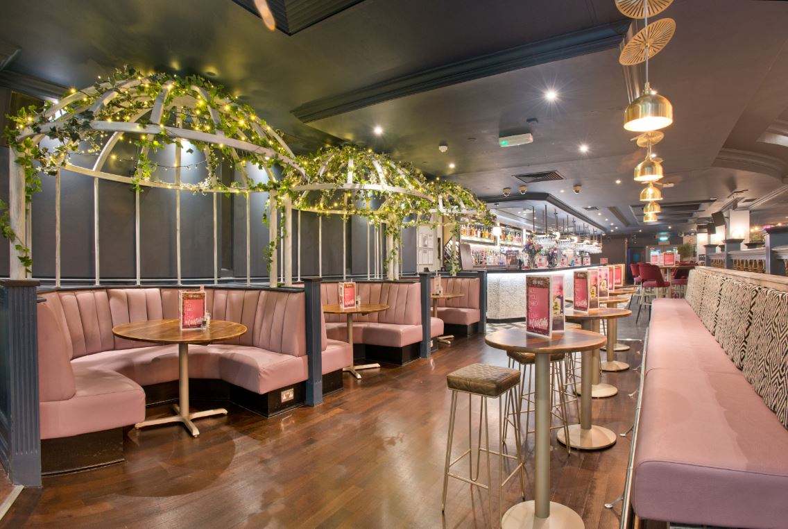 pink-booths-and-tables-inside-slug-and-lettuce-bar