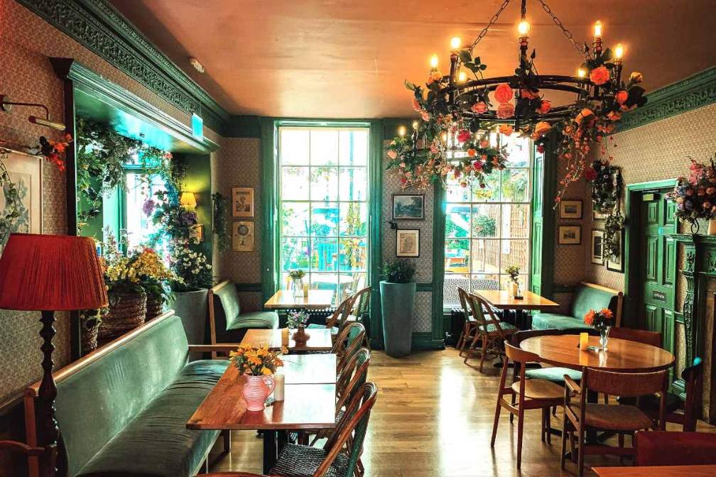 restaurant-tables-inside-the-magic-garden-cocktail-bar