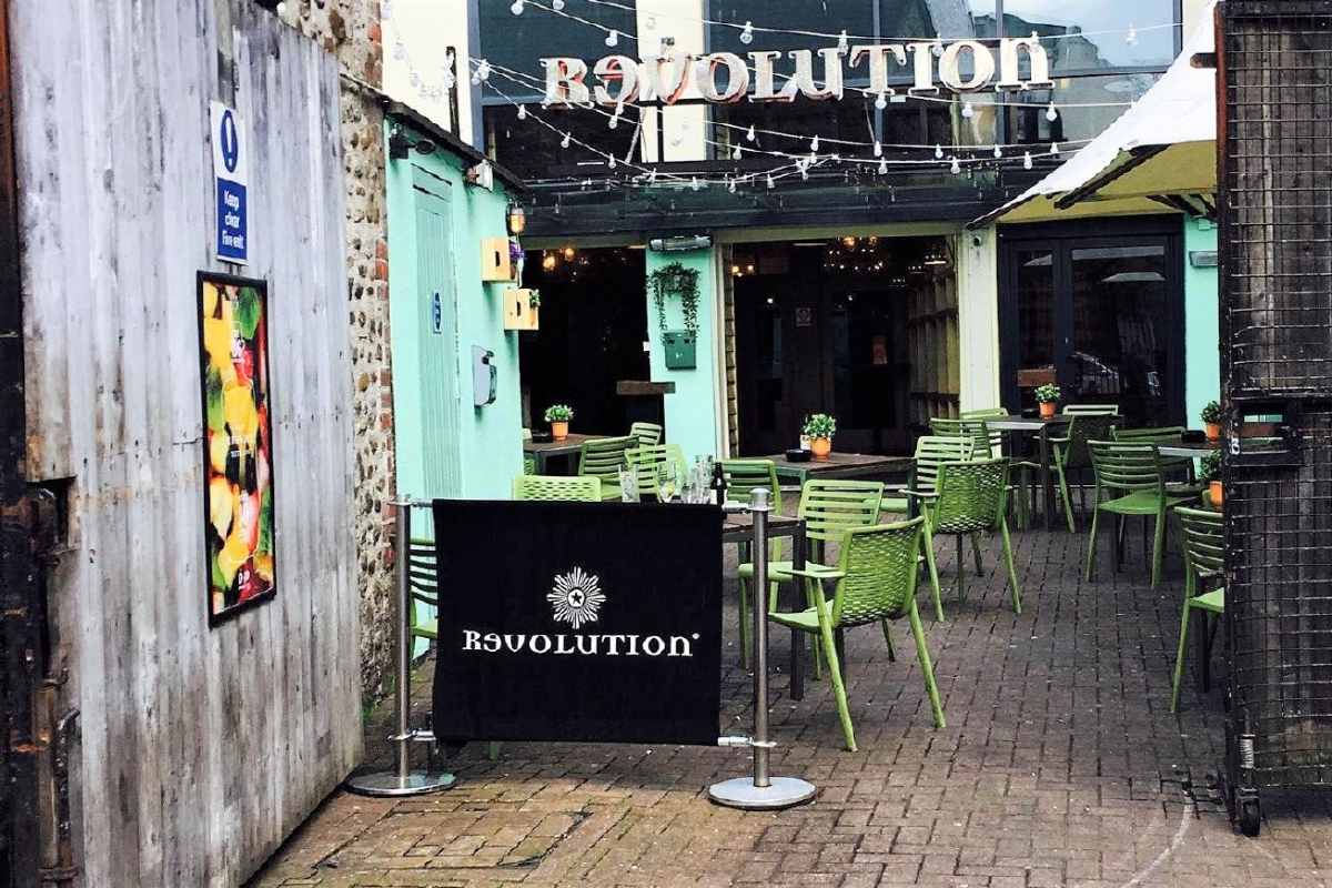tables-and-seating-outside-revolution-bar-in-daytime