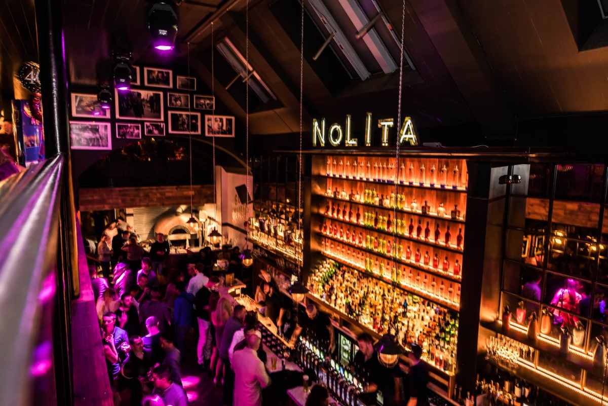 people-drinking-inside-nolita-bar-at-night