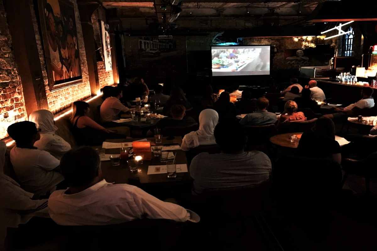 people-watching-movie-in-pub-with-taste-film