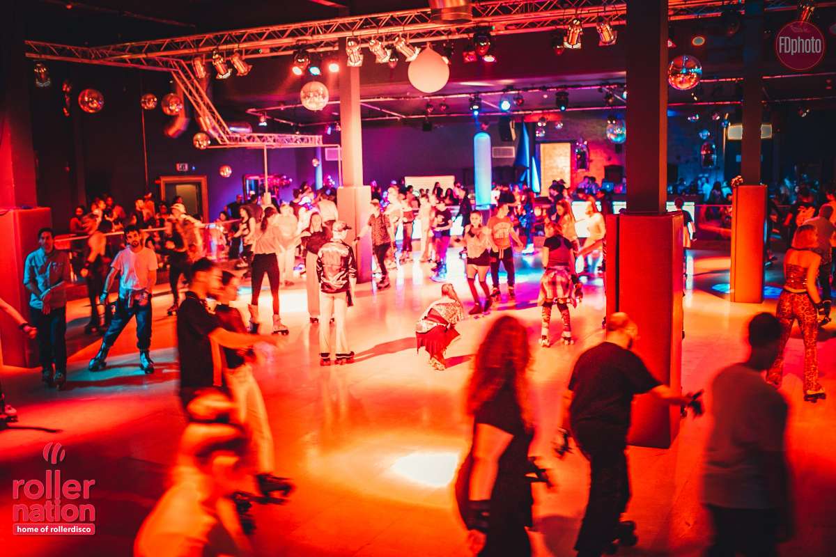 people-rollerskating-indoors-at-roller-nation-in-the-evening