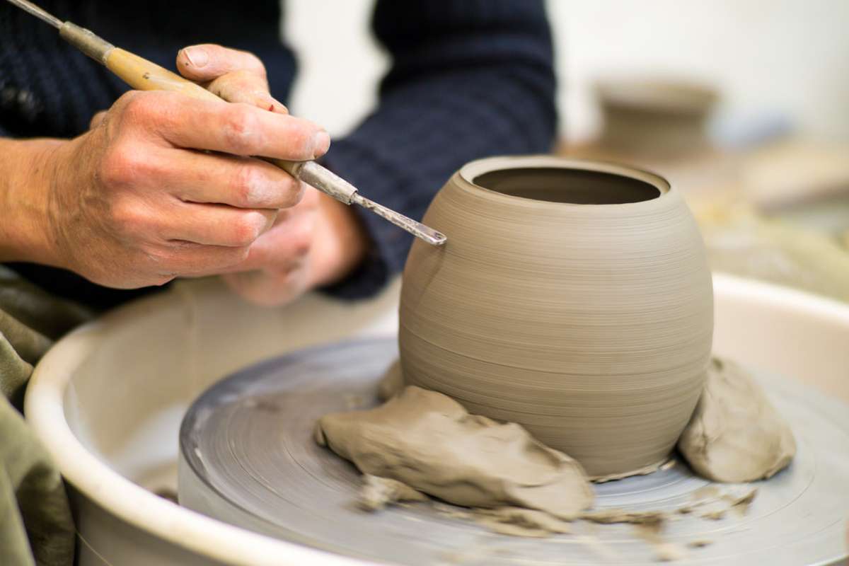 person-doing-pottery-at-hands-on-pottery-in-the-daytime