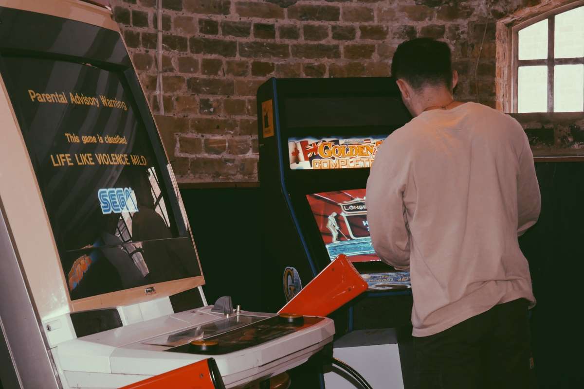 person-playing-arcade-games-at-wapping-tavern