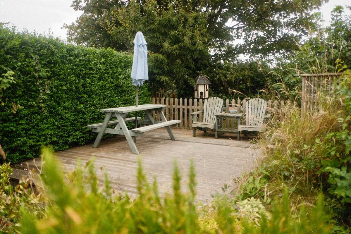 picnic-table-and-seats-in-garden-on-cloudy-day