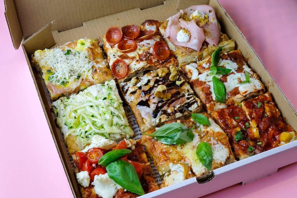 selection-of-pizza-slices-in-a-box-at-pizza-collective