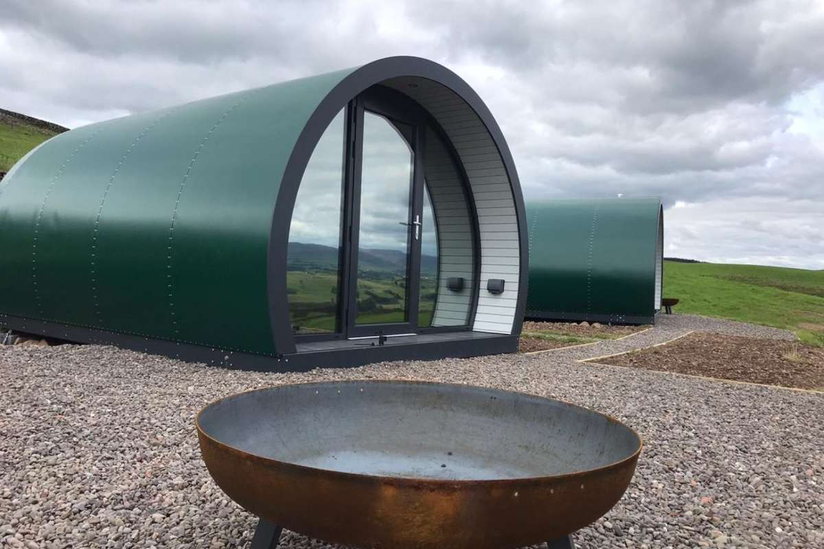 exterior-of-a-pod-with-fire-pit-at-hillhead-farm-pods-in-the-daytime