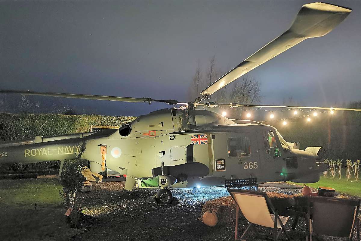 exterior-of-the-helicopter-at-manor-house-helicopter-glamping-at-nighttime