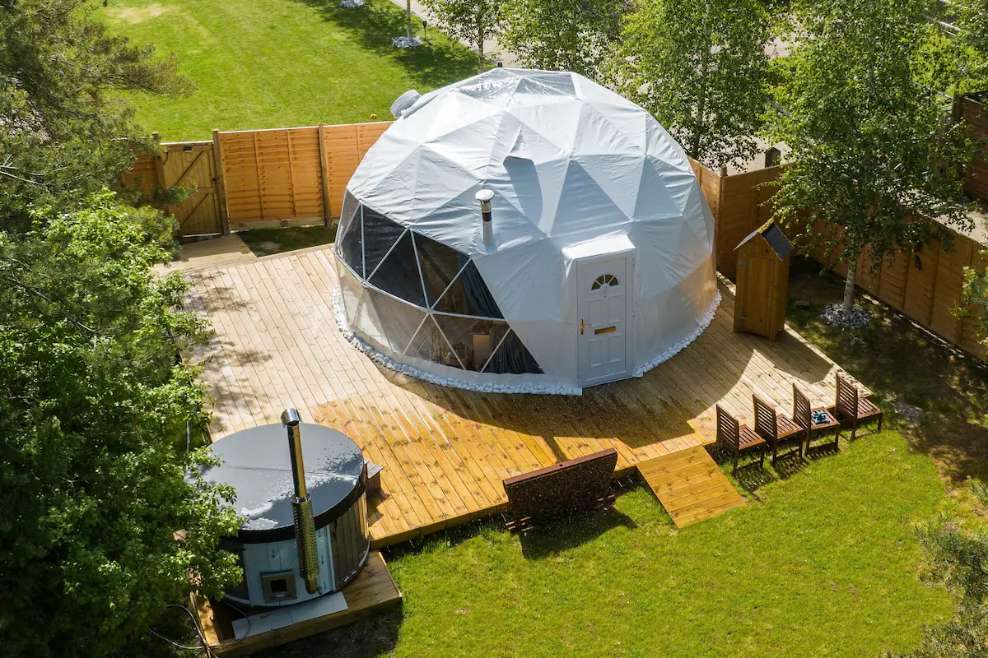 luxury-geo-dome-and-hot-tub-seen-from-above-in-the-daytime