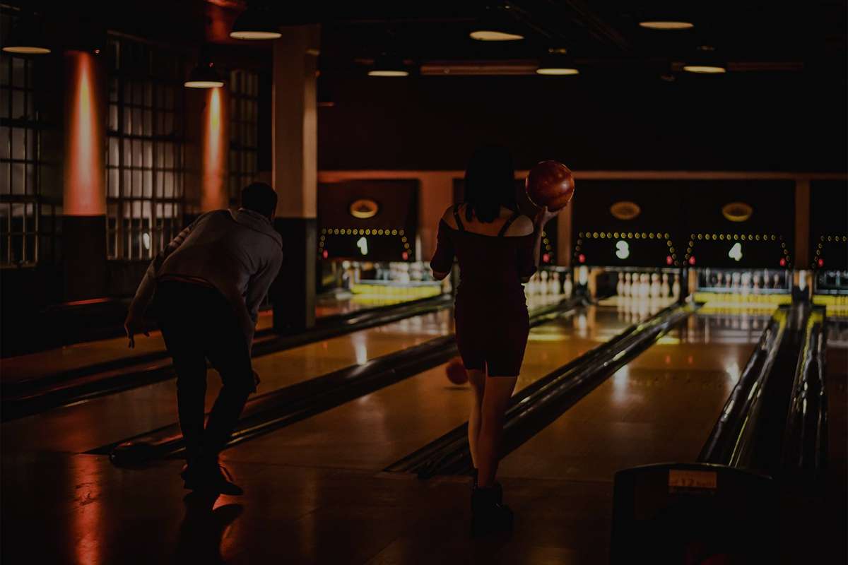 people-bowling-at-the-lanes-at-nighttime